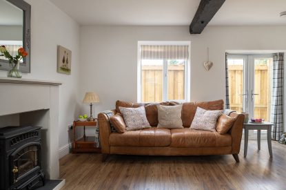The sofa in the living room at The Milking Parlour, Wiltshire 