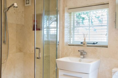 A bathroom with walk-in shower at Brightwaters Stables, Hampshire