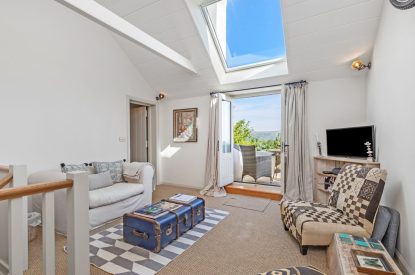 A seating area at Little Haven, Gower