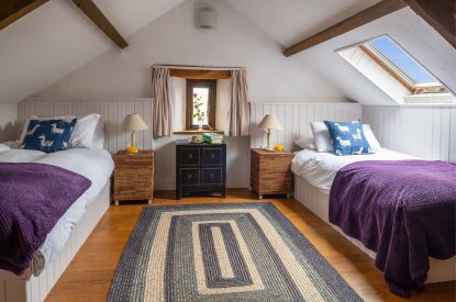 A twin bedroom at Valley View Barn, Devon