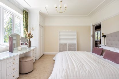 A kingsize bedroom at The Vineyard Lake House, Malvern Hills