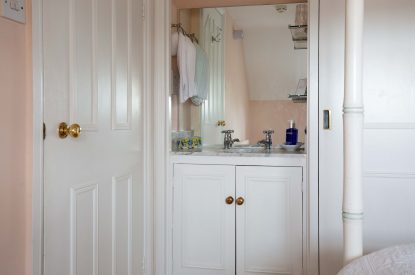 Four poster bedroom at Byron Cottage, Cotswolds