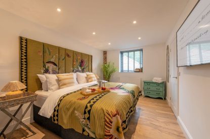 A super king size bedroom at The Pool house, Chapmanslade, Wiltshire
