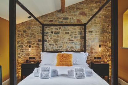 A king size bedroom at Puddle Duck Cottage, Somerset