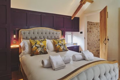 A king size bedroom at Puddle Duck Cottage, Somerset