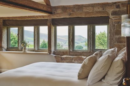 A king size bedroom at Rye Top Farm, Uppermill, Peak District