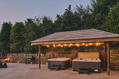 The covered hot tubs at Rye Top Farm, Uppermill, Peak District
