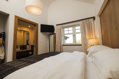 The super king size bedroom at Basket Makers Cottage, Roundstone, Galway