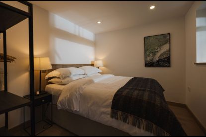 Queen size bedroom bedroom at Map Maker's Cottage, Roundstone, Galway