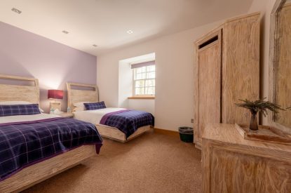 A twin bedroom at Lomond House, Loch Lomond