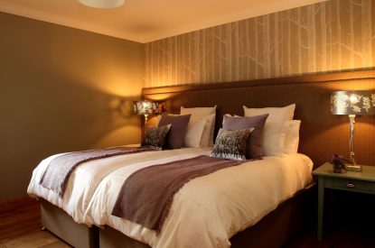 A super king size bedroom at The Clans, Fife