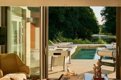 View of the heated outdoor swimming pool at Edgewater House, Hampshire