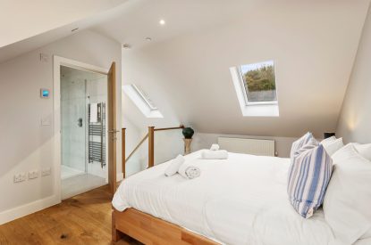 A super king size bedroom at Oxwich Retreat, Gower