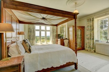 A four poster bedroom at Chulmleigh Manor, Devon