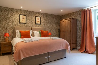 A super king sized bedroom at Poppy Cottage, Somerset