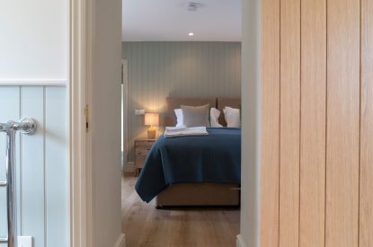 A super king sized bedroom at Poppy Cottage, Somerset