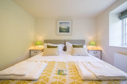 A super king sized bedroom at The Creamery, Somerset