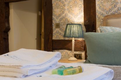 A super king sized bedroom at The Thatched Cottage, Somerset