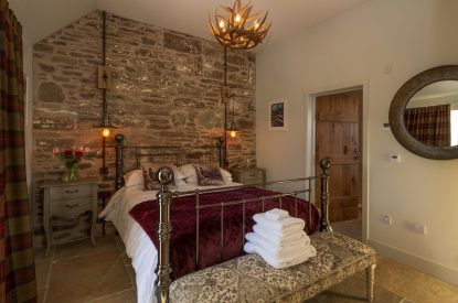 A king sized bedroom at Torran Steading, Perthshire