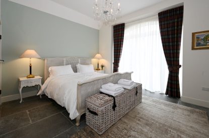 The king sized bedroom at The Highland Croft, Perthshire