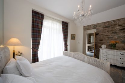 The king sized bedroom at The Highland Croft, Perthshire
