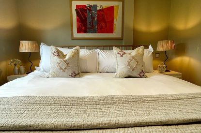 A super-king sized bedroom at Wheatsheaf Barn, Hampshire