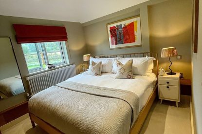 A super-king sized bedroom at Wheatsheaf Barn, Hampshire