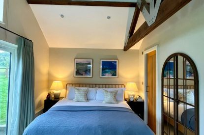 A super-king sized bedroom at Wheatsheaf Barn, Hampshire