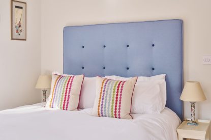 A king sized bedroom at Hockham Pool House, Norfolk Coast