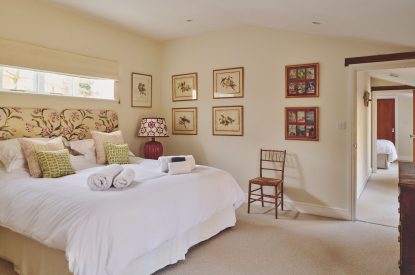 A super king sized bedroom at Hockham Pool House, Norfolk Coast