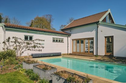 The heated outdoor swimming pool at Hockham Pool House, Norfolk Coast