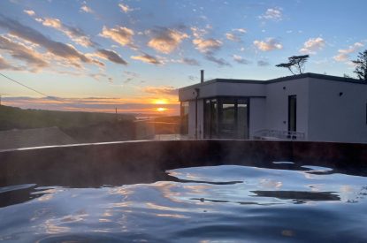 The hot tub at sunset at Seascape House, Cornwall