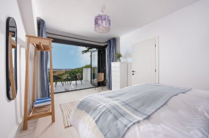 A super king-size bedroom at Watergate House, Cornwall