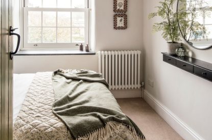 A king size bedroom at Sweet Pea Cottage, Litton, Peak District