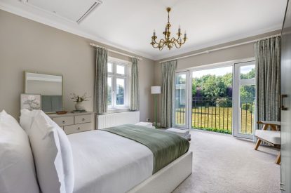 A king sized bedroom at Merry Manor, Essex