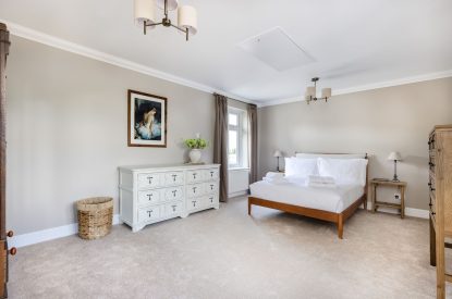 A king sized bedroom at Merry Manor, Essex