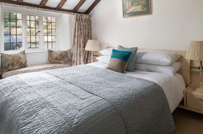 A king sized bedroom at The Old Post Office, Cotswolds