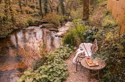 Seating by the river at The Enchanted Cottage, Cornwall