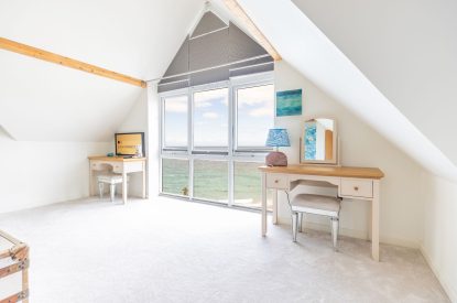 A super king sized bedroom at Tides Edge, Cornwall