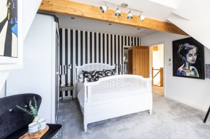 A king sized bedroom at Tides Edge, Cornwall
