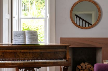 The baby grand piano at Quarter House, Scottish Borders