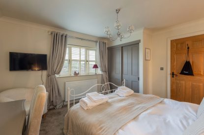 A king sized bedroom at Primrose Cottage, Yorkshire
