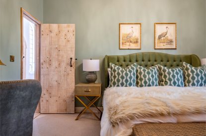 A king-size bedroom at The Priory Gatehouses, Essex