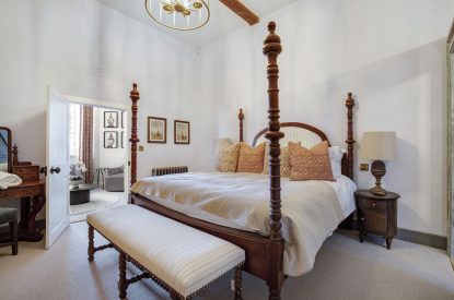 A super-king size bedroom at The Priory Retreat, Essex