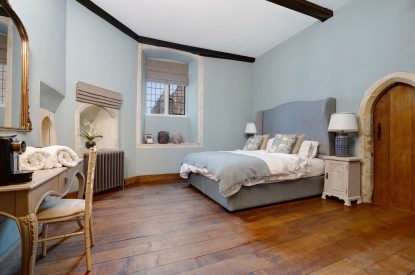 A super king sized bedroom at The Priory Retreat, Essex