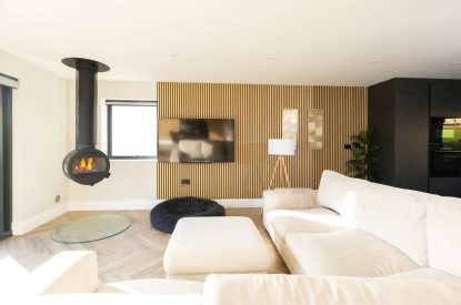 The lounge with wood burner at Panorama Point, Cornwall