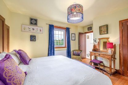 A super-king size bedroom at An Taigh Geal, Argyll and Bute