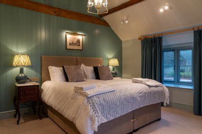 A super-king size bedroom at Parkview Farmhouse, Somerset