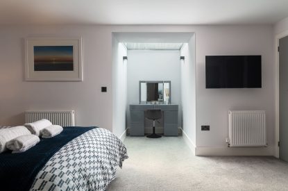 A king-size bedroom at The Tractor Shed, Worcestershire