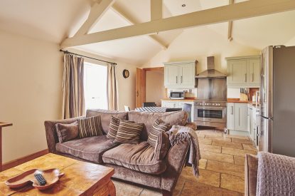The living room and kitchen at Barn Owl Lodge, Peak District